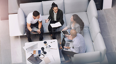 Buy stock photo High angle shot of a group of businesspeople having a meeting at a conference