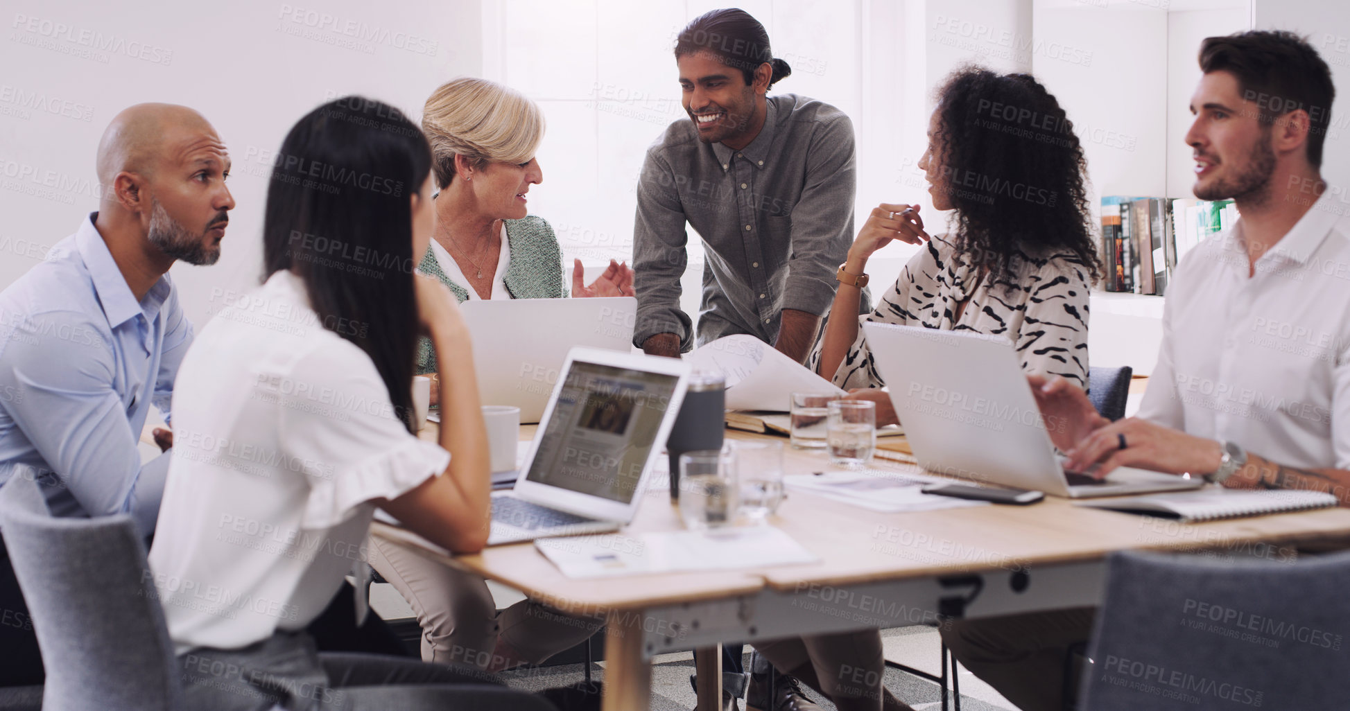 Buy stock photo Talking, staff and group in a meeting, planning and discussion with teamwork, partnership or collaboration. Business people, team or men with women, laptop or documents with conversation and creative