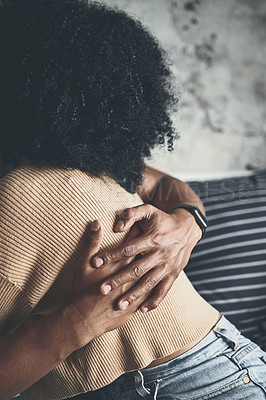 Buy stock photo Closeup shot of a couple hugging each other at home