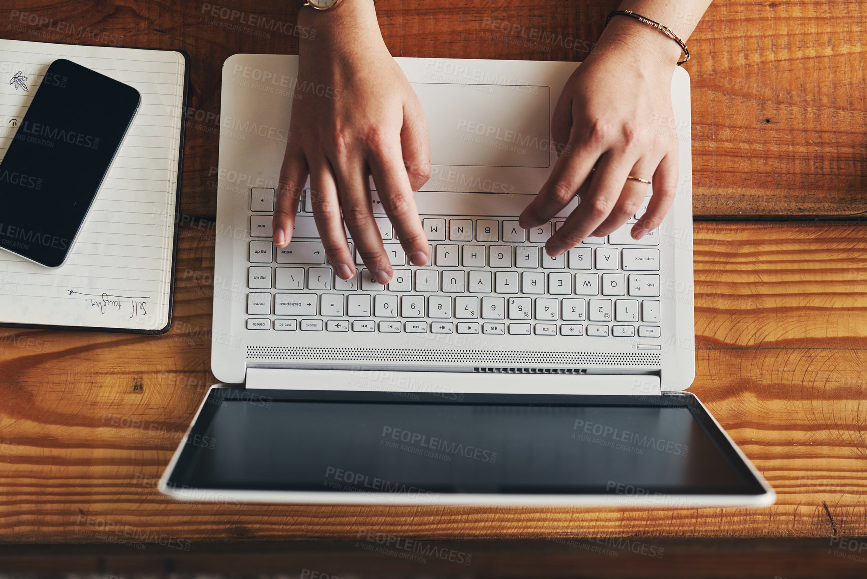 Buy stock photo high angle shot of an unrecognisable woman using a laptop while working from home