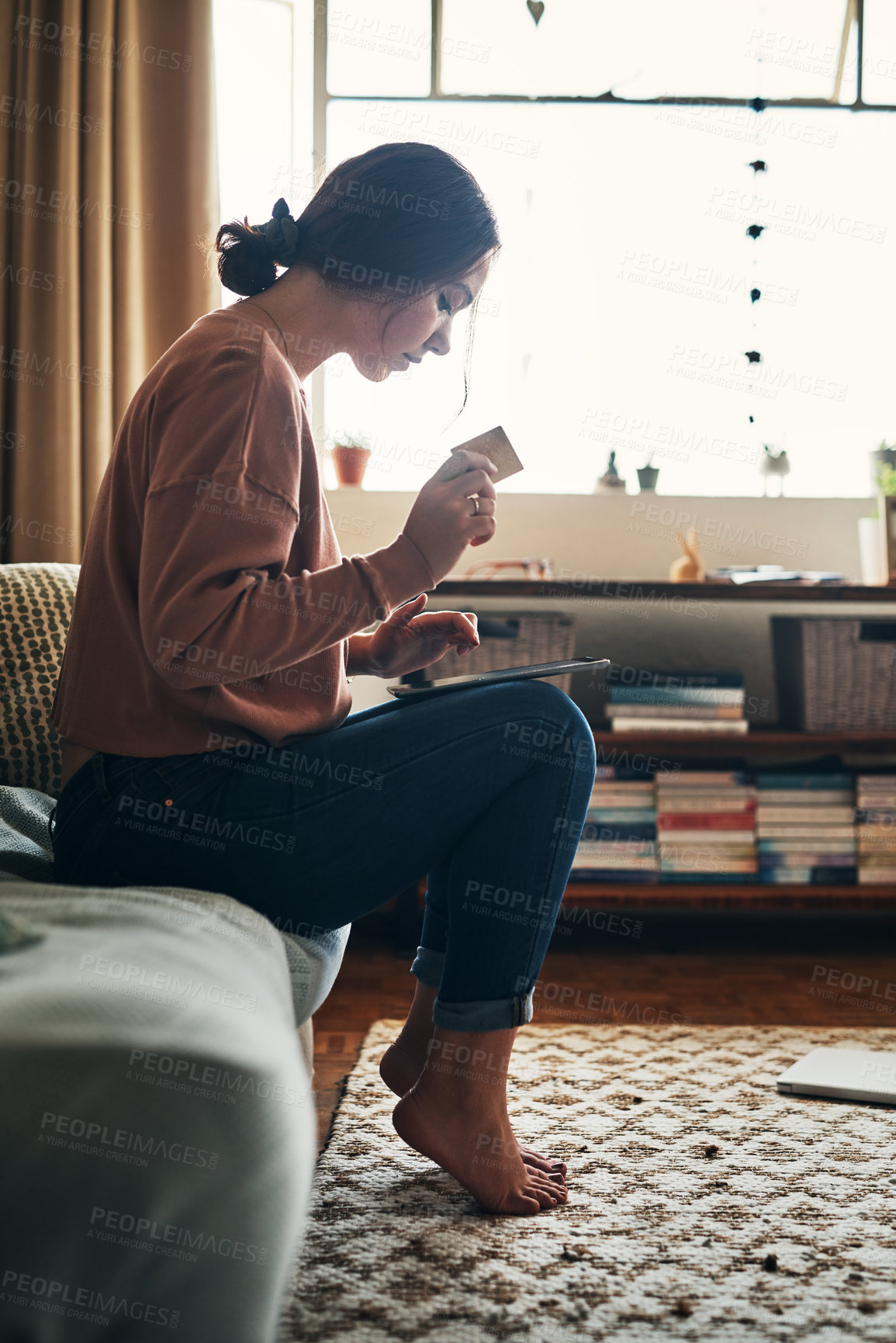 Buy stock photo Credit card, tablet and woman on sofa in living room for ecommerce, internet or online shopping. Digital technology, relax and girl paying bill, mortgage or streaming subscription in home lounge