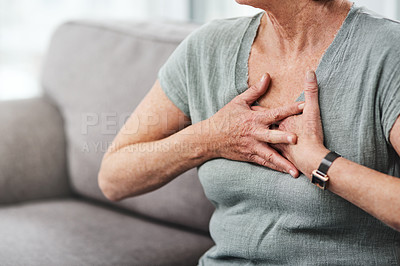Buy stock photo Heart attack, chest pain and sick senior woman with asthma in her home living room or couch with an emergency. Crisis, medical and elderly person with discomfort due to illness or breathing problem