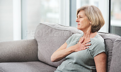 Buy stock photo Heart attack, chest and senior woman with pain in her home living room or couch with an emergency or crisis on a sofa. Asthma, medical and sick elderly person with discomfort due to illness