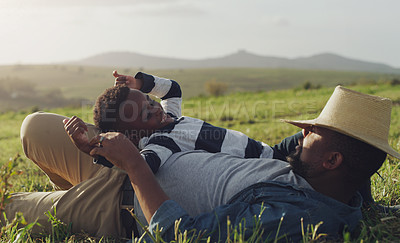 Buy stock photo Farm, agriculture and father and child on grass for bonding, playing and relax together for farming. Black family, nature and dad with young boy for holiday, adventure and vacation in countryside