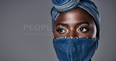 Buy stock photo Shot of a beautiful young woman wearing a denim head wrap and mask