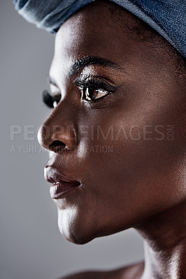 Buy stock photo Shot of a beautiful young woman wearing a denim head wrap while posing against a grey background