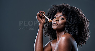 Buy stock photo Shot of a beautiful young woman holding a honey dipper against her face