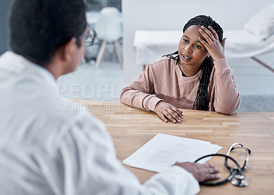 Buy stock photo Sick, ill or stressed patient with doctor talking in medical consultation, checkup or visit in clinic, hospital or healthcare center. Tired woman with headache explaining symptoms to professional gp 