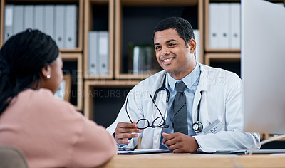 Buy stock photo Doctor talking to patient about medical diagnosis or healthcare at an appointment or inside a clinic office. Smiling professional male physician giving good advice to client in checkup consultation