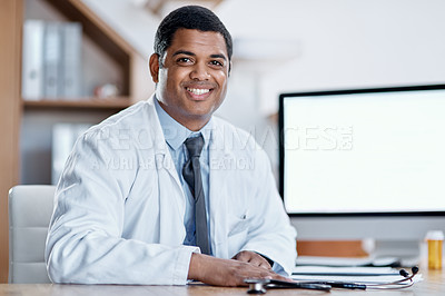 Buy stock photo Portrait of a young doctor working in his office