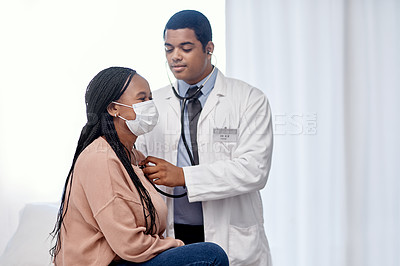 Buy stock photo Shot of a doctor examining a patient with a stethoscope