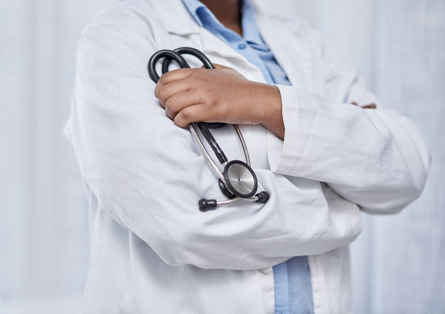 Buy stock photo Closeup shot of an unrecognisable doctor holding a stethoscope in a hospital