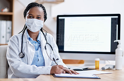 Buy stock photo Portrait of a young doctor writing notes while working in her office