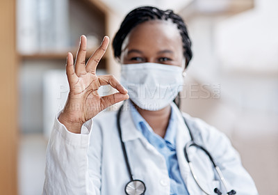 Buy stock photo Portrait of a young doctor making an okay sign