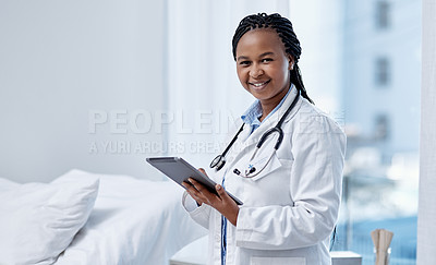 Buy stock photo Portrait of a young doctor using a digital tablet in a hospital