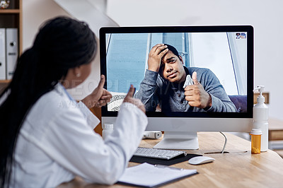 Buy stock photo Shot of a young man showing thumbs up during a video call with a doctor on a computer