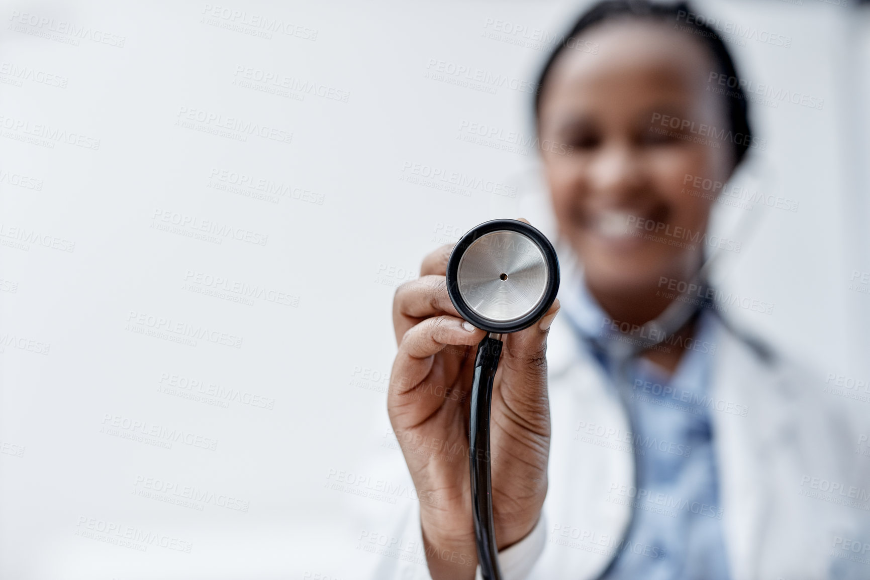 Buy stock photo Closeup shot of a young doctor holding a stethoscope