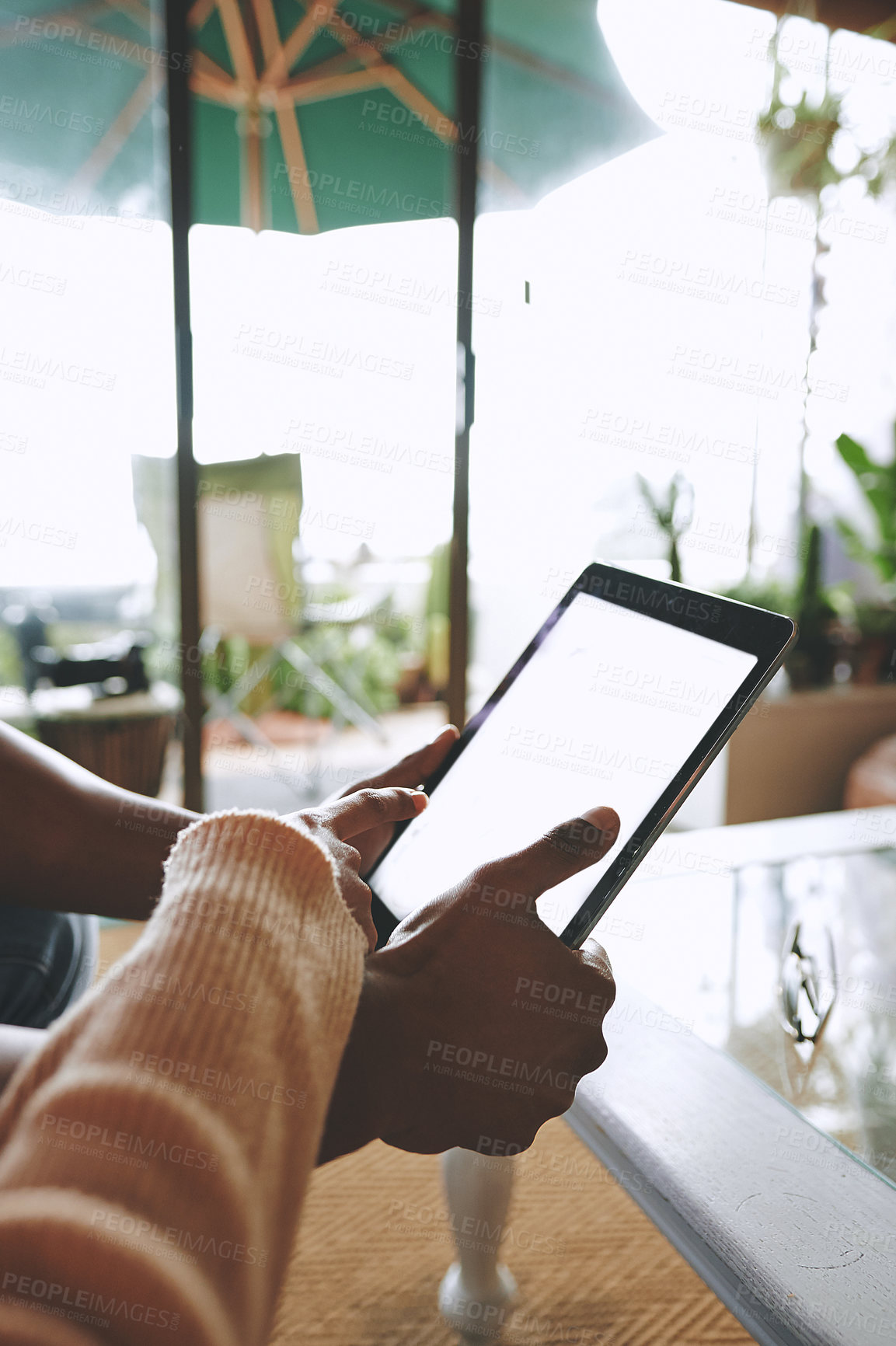 Buy stock photo Closeup shot of an unrecognisable couple using a digital tablet together at home