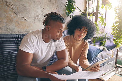 Buy stock photo Home, budget and couple with tablet, documents or rent application for online tax report on sofa. African, man and woman on couch with paperwork, mortgage contract or digital app for financial plan