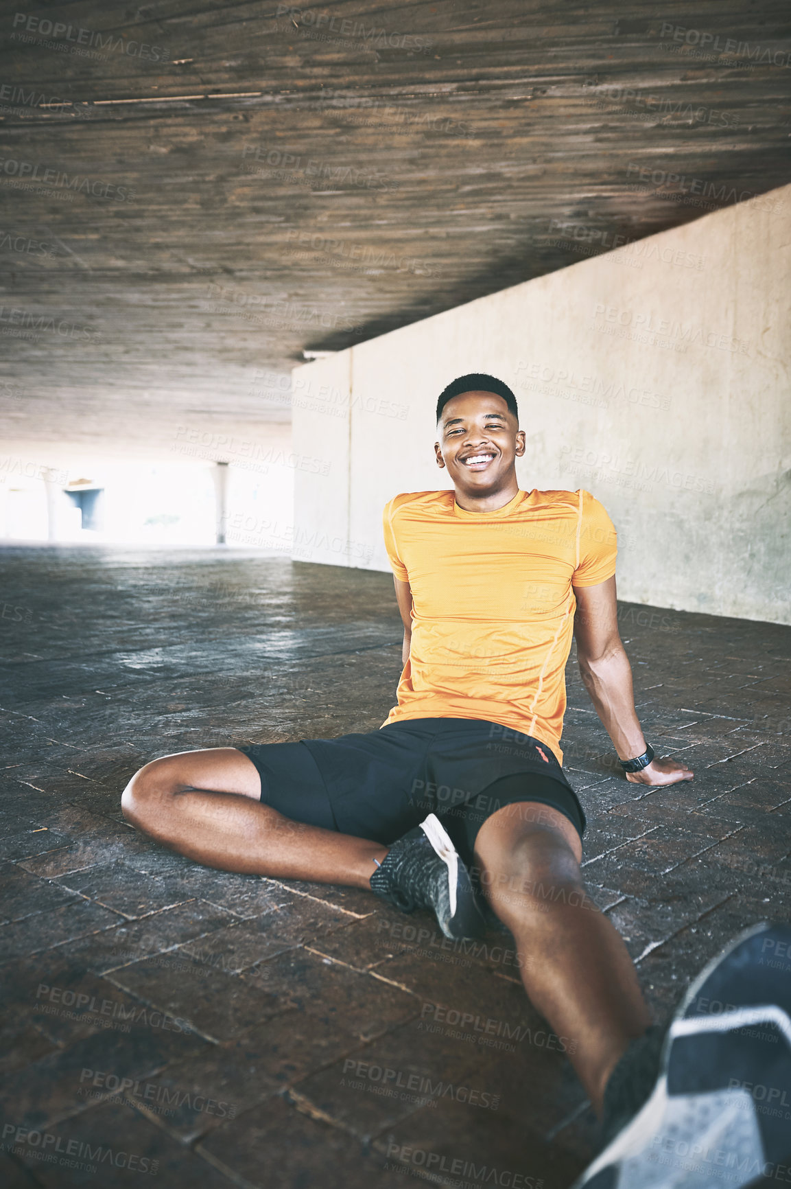 Buy stock photo Portrait of a young man taking a break after working out against an urban background