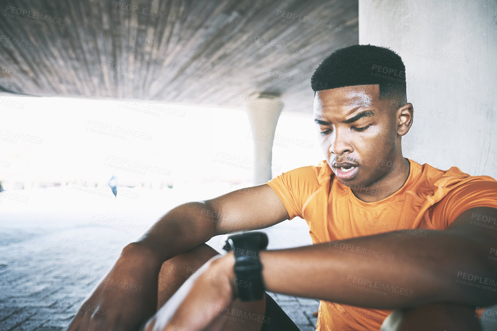 Buy stock photo Tired, fitness and black man resting outdoor with workout fatigue, running break and relax in parking lot. Marathon runner, athlete and exhausted with cardio challenge, exercise recovery and sweating