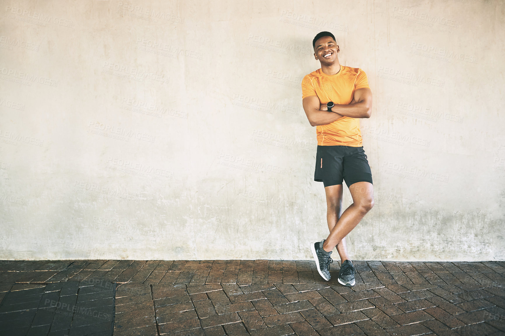 Buy stock photo Urban, black man and portrait with confidence for fitness, satisfaction and happy on break for workout. Mockup space, male person and runner with arms crossed for performance, exercise and wellness