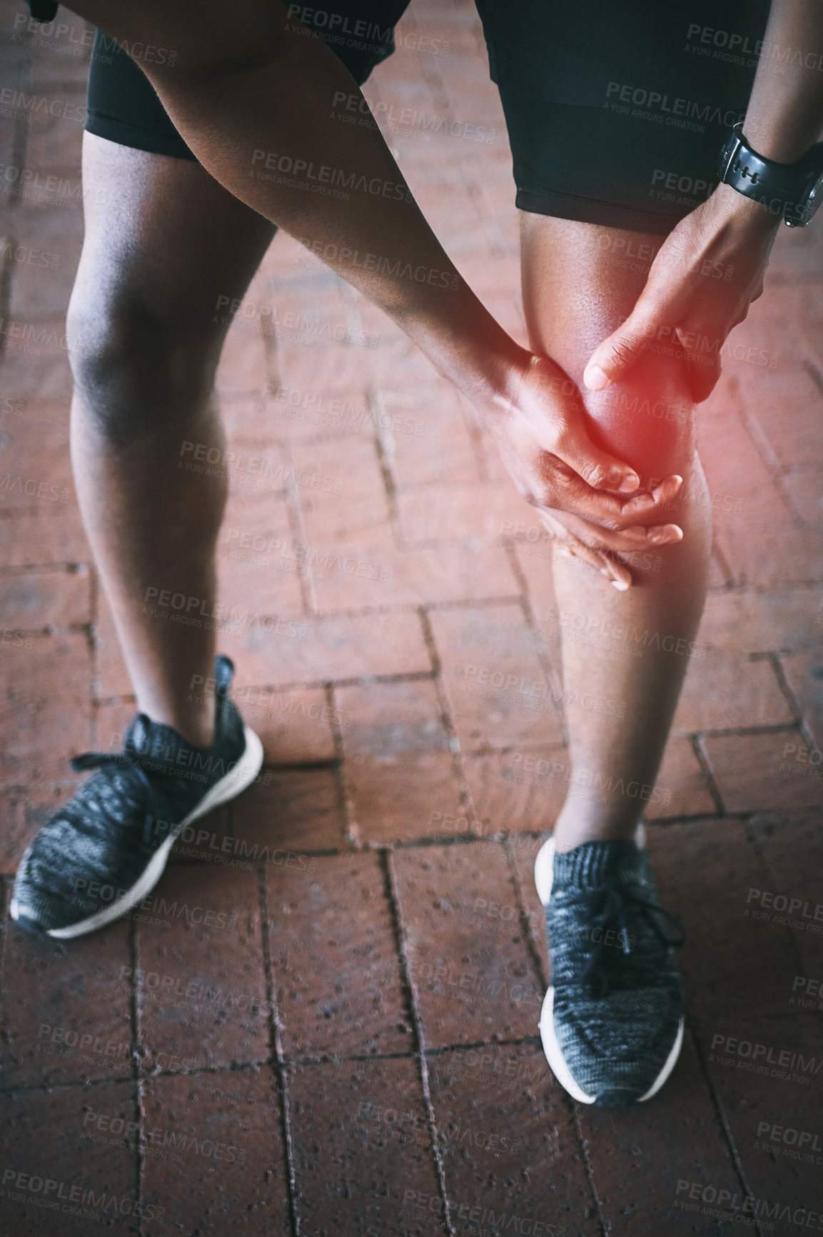 Buy stock photo Person, hands and injury with knee pain for workout, muscle tension or stretching accident by closeup. Above, runner and discomfort with red glow for anatomy, fibromyalgia or inflammation for fitness