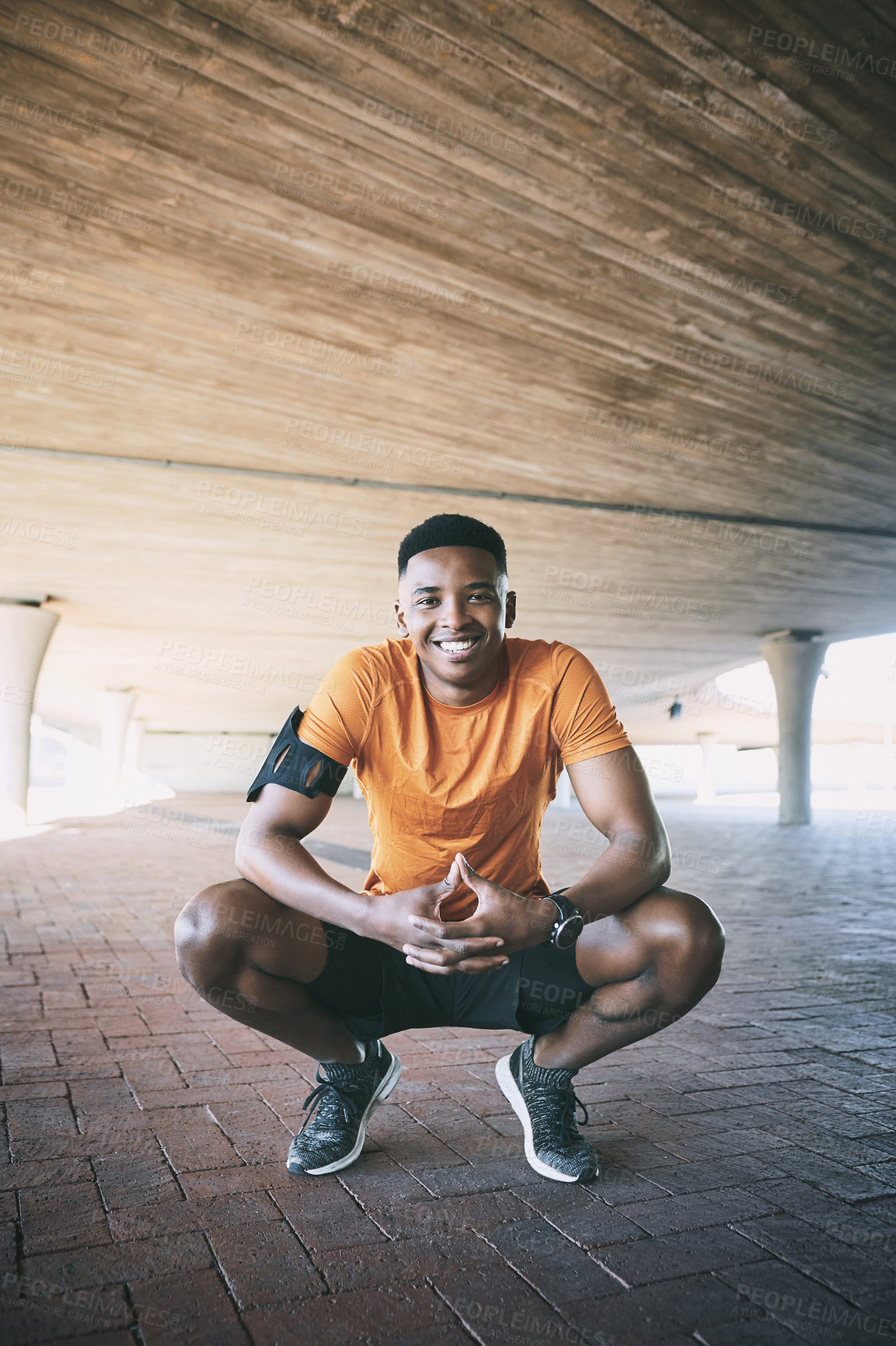 Buy stock photo Portrait of a young man taking a break after working out against an urban background