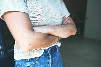 Buy stock photo Cropped shot of an unrecognizable business owner standing at the entrance of her pottery studio alone with her arms folded