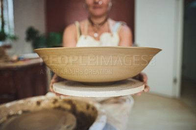 Buy stock photo Shot of a woman making a bowl in a pottery studio