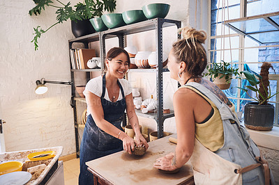 Buy stock photo Women, learning and smile in workshop for pottery, guide and development for new skill with teacher. People, mentor and talking with mold, craft and design with art, sculpture and creativity in class