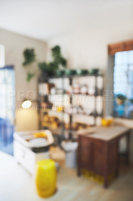 Buy stock photo Blurred shot of various vases and pots on a shelf in a pottery studio