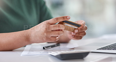 Buy stock photo Shot of an unrecognisable woman using a laptop and credit card at her desk