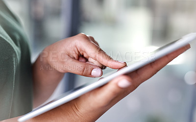 Buy stock photo Shot of an unrecognisable woman using a digital tablet