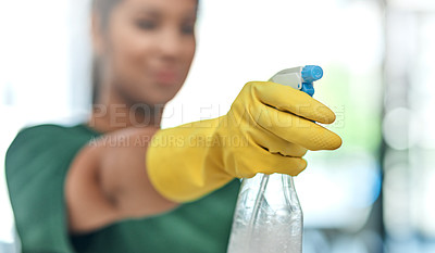 Buy stock photo Shot of a young woman cleaning a modern office
