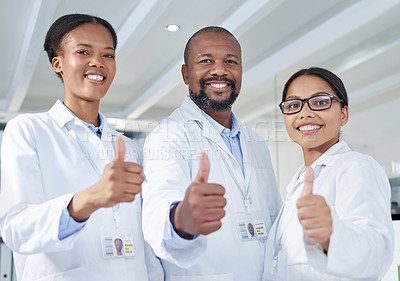 Buy stock photo Portrait of a group of scientists showing thumbs up in a lab