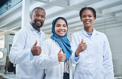 Buy stock photo Portrait of a group of scientists showing thumbs up in a lab