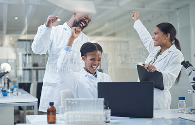 Buy stock photo Shot of a group of scientists cheering while working in a lab