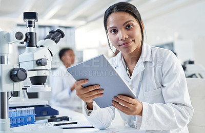 Buy stock photo Portrait of a young scientist using a digital tablet in a lab