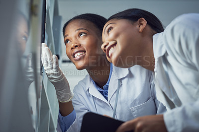 Buy stock photo Shot of two scientists working in a lab