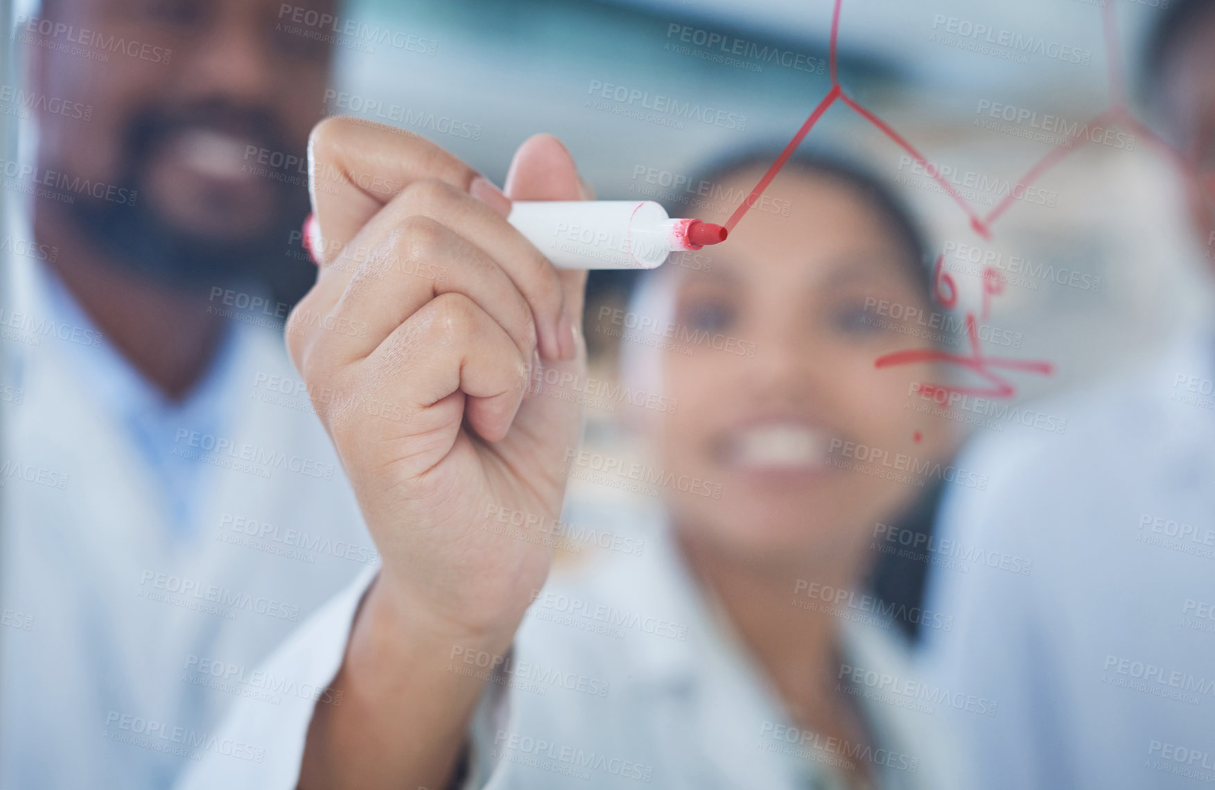 Buy stock photo Shot of a group of scientists having a brainstorming session in a laboratory