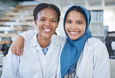 Buy stock photo Portrait of two young scientists working together in a laboratory