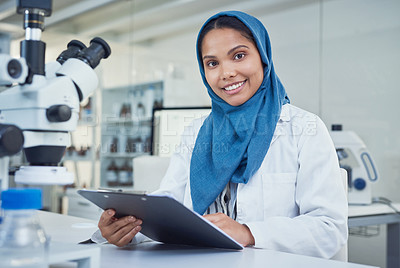 Buy stock photo Portrait of a young scientist conducting research in a laboratory