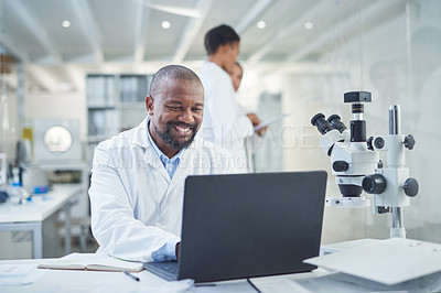 Buy stock photo Shot of a confident scientist using a laptop to conduct research in a laboratory