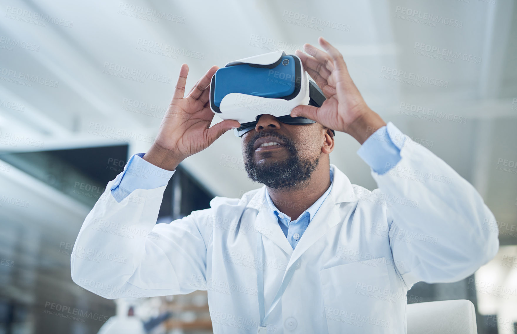 Buy stock photo Shot of a scientist using a virtual reality headset while conducting research in a laboratory