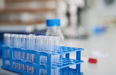 Buy stock photo Shot of test tubes on a table in a laboratory