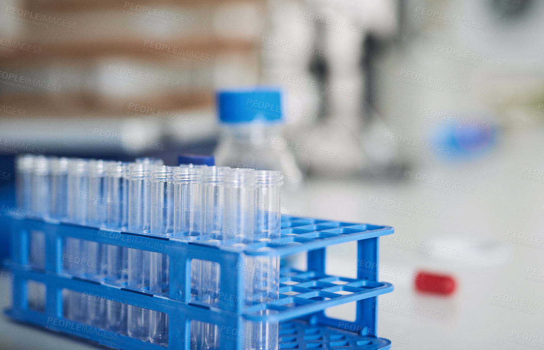 Buy stock photo Shot of test tubes on a table in a laboratory