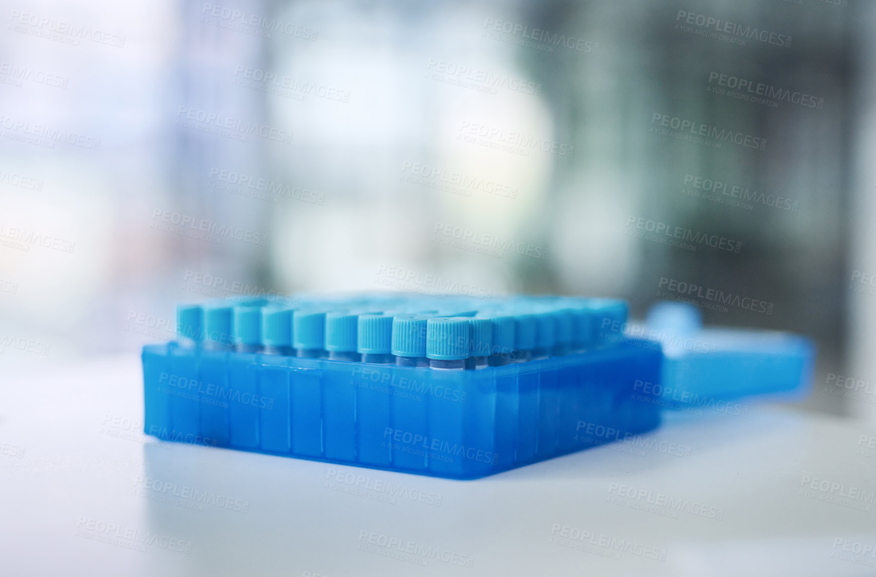 Buy stock photo Shot of test tubes on a table in a laboratory