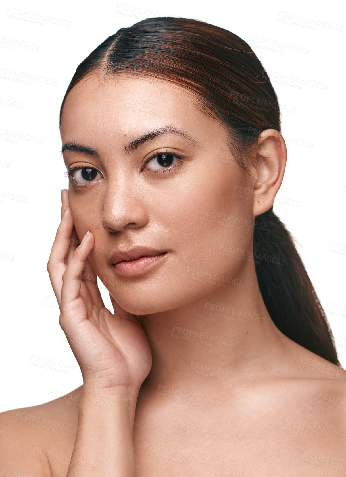 Buy stock photo Shot of a beautiful young woman touching her face while standing against a white background