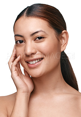 Buy stock photo Shot of a beautiful young woman touching her face while standing against a white background